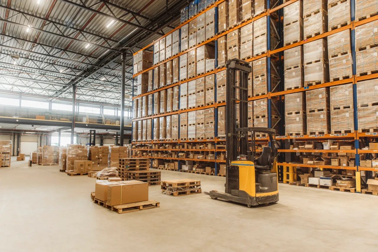 Interior of Tulare Industrial Center warehouse with high-bay racking and forklift
